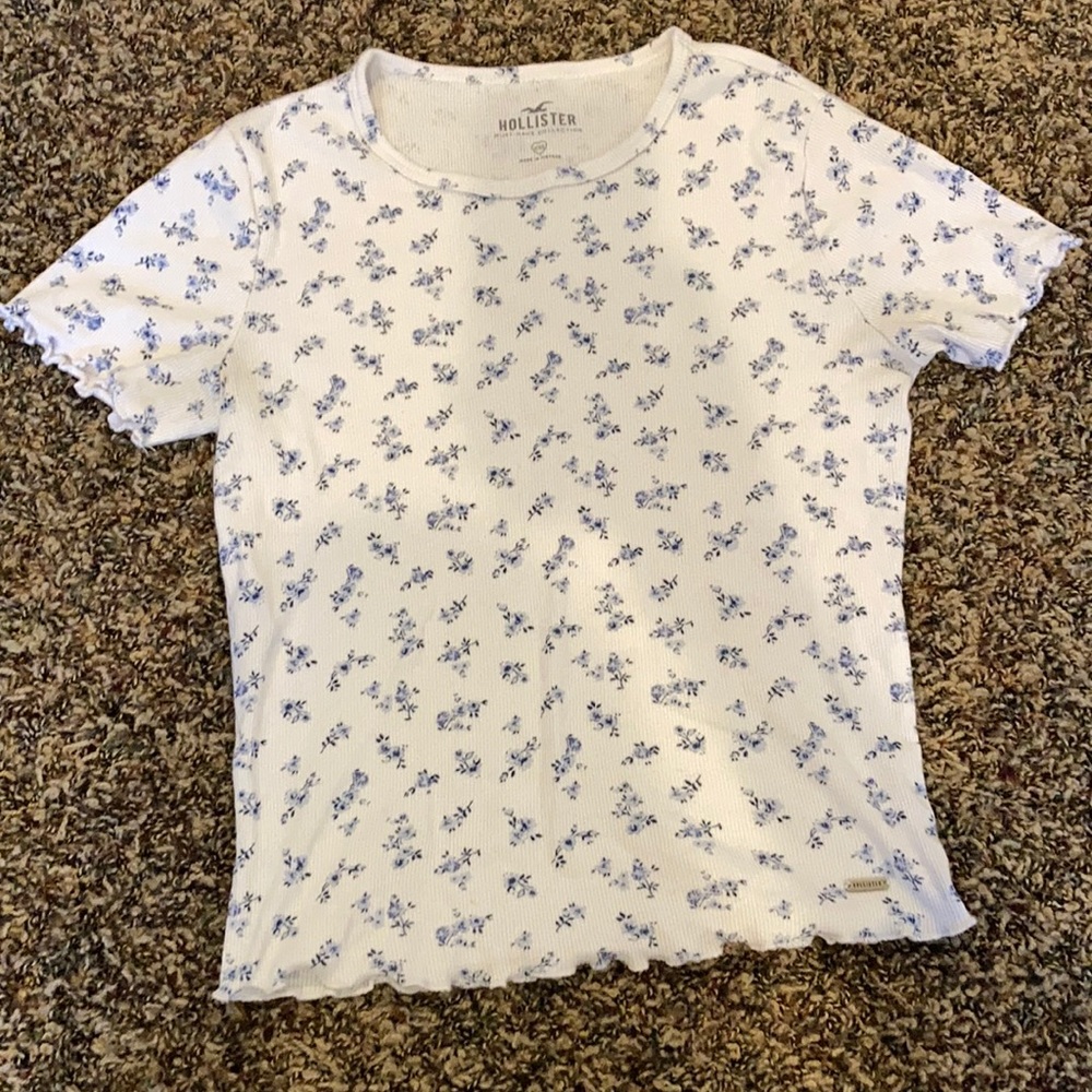 White hollister shirt, with blue flowers